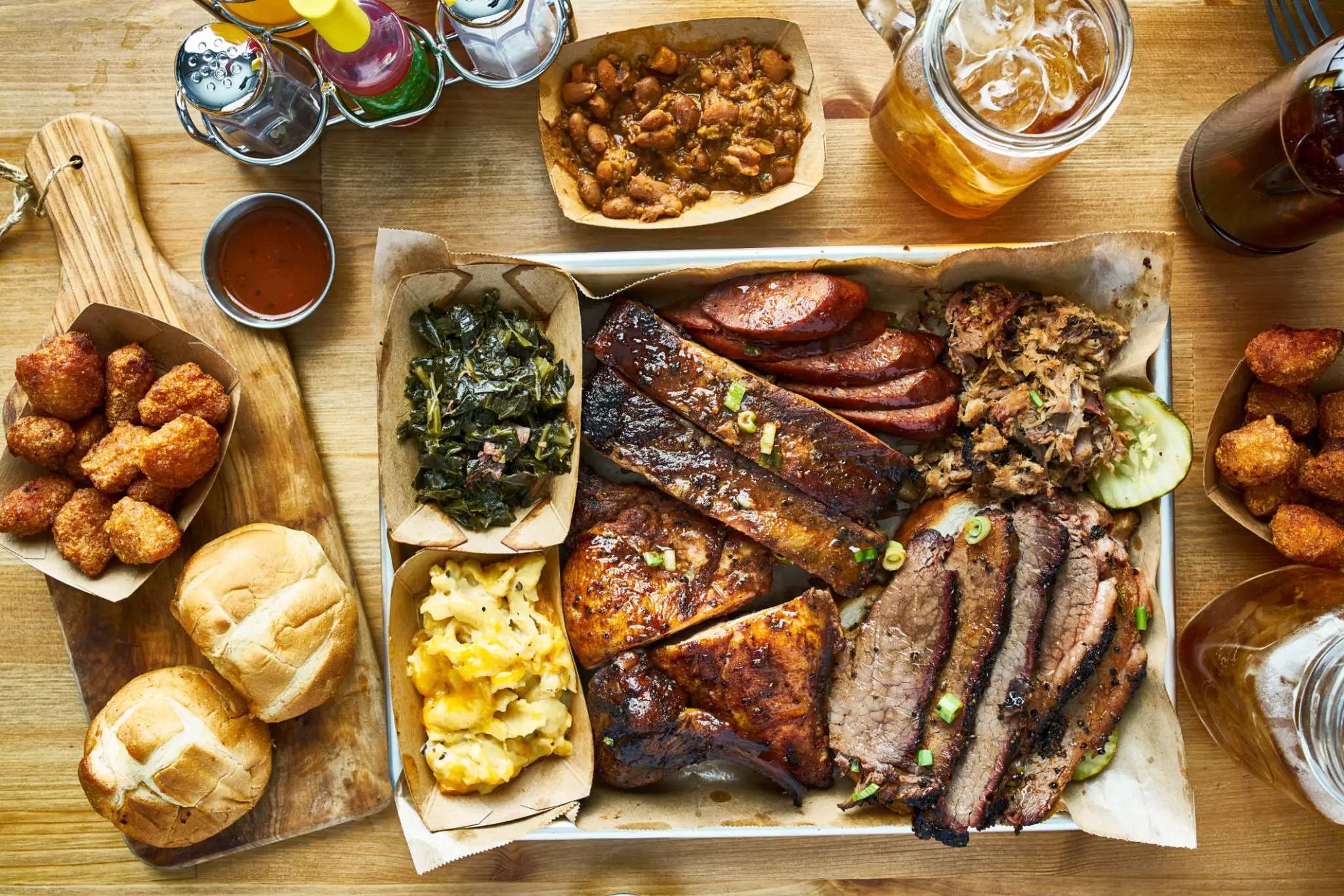 Barbecue platter with ribs, brisket, sausage, sides