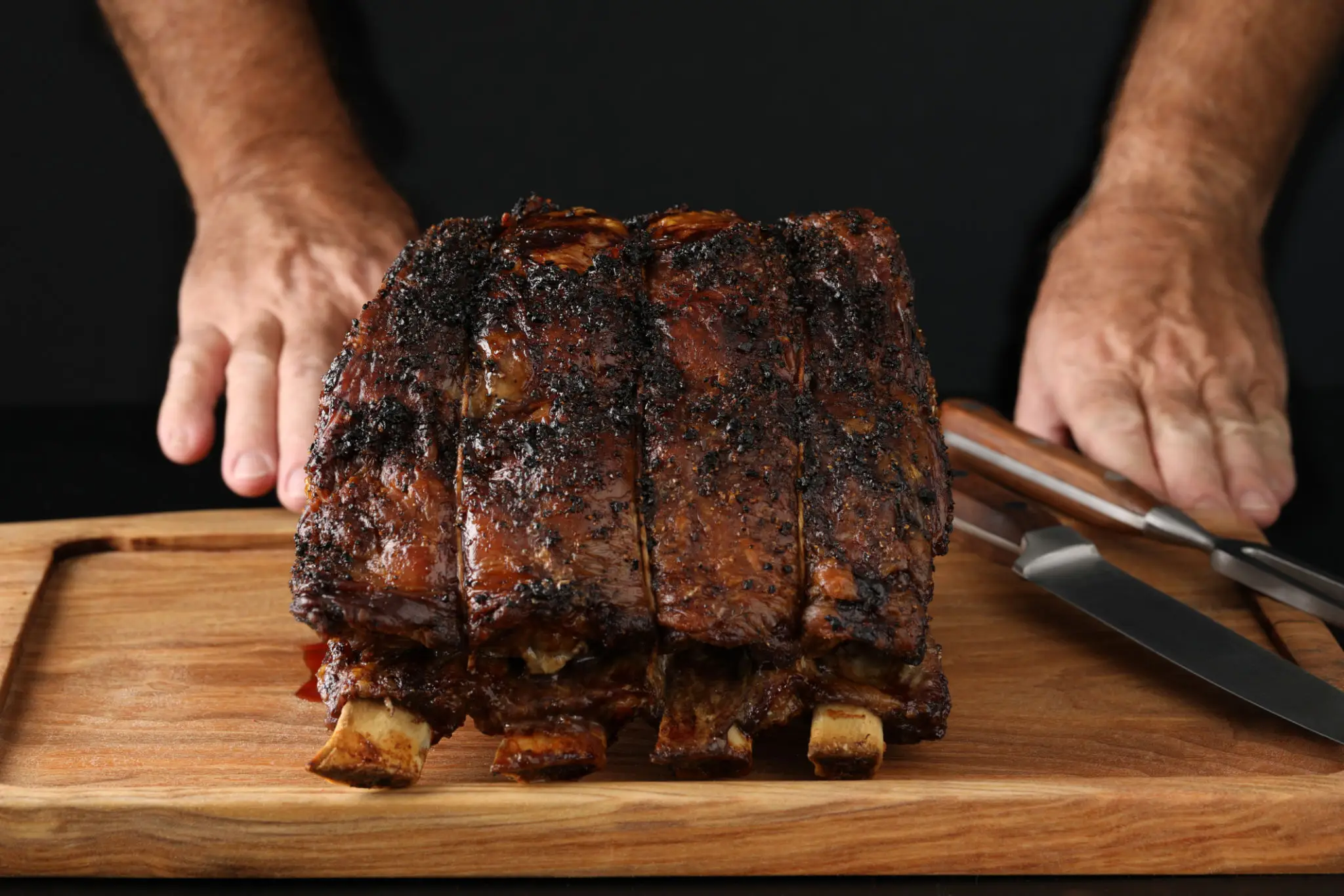 Smoked beef rib roast on wooden board