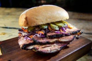 Smoked brisket sandwich with slaw and pickles